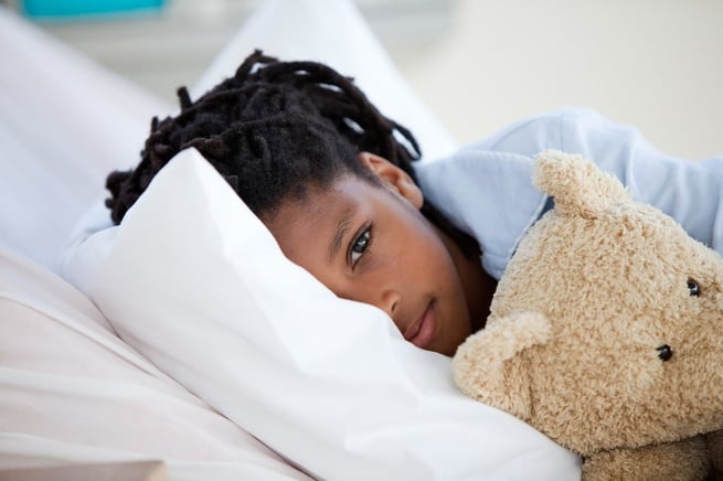 Young Boy in Hospital  hugging his teddy bear.jpeg